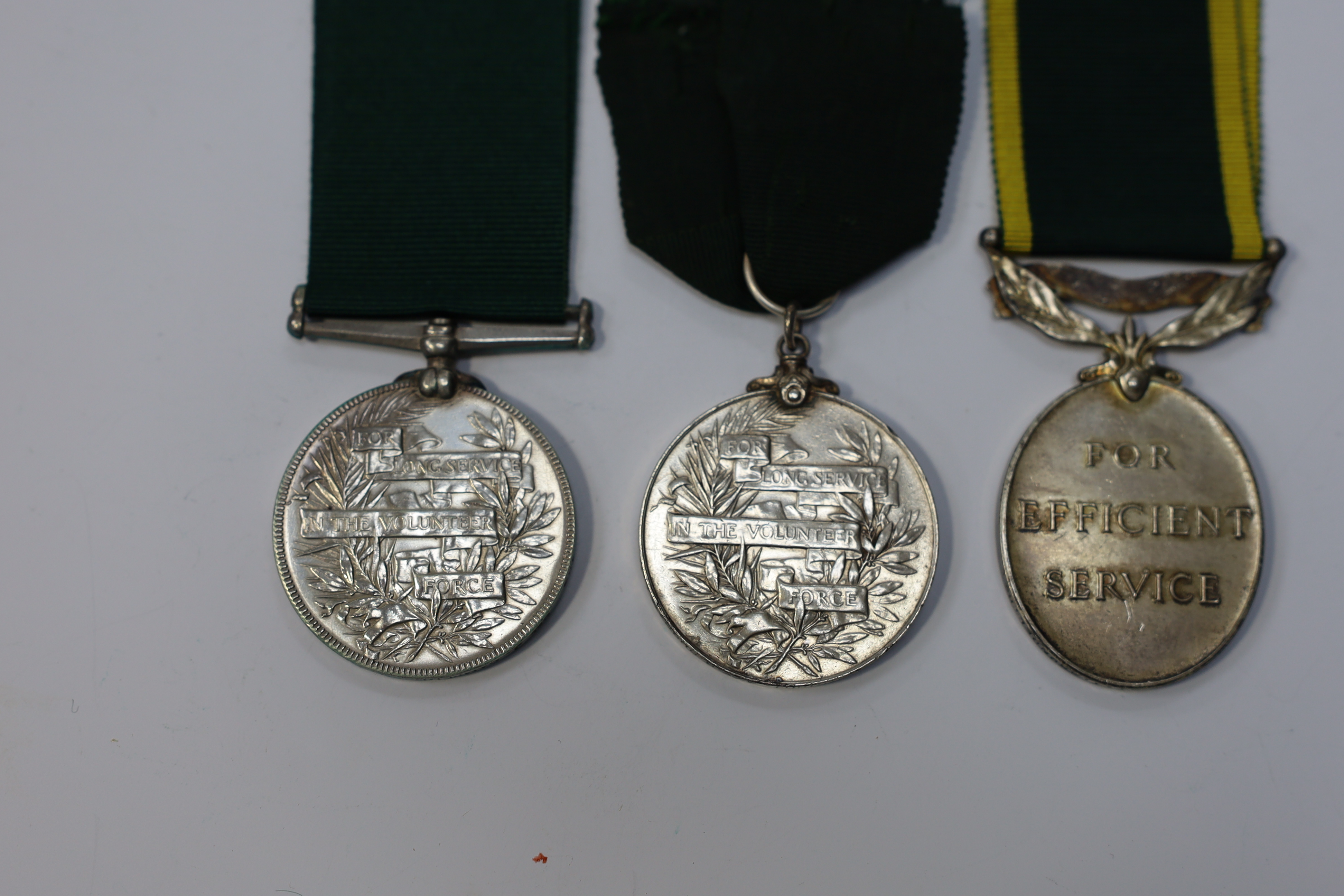 Three assorted service medals; Vict Volunteer Long Service to 186. Cpl. J.Camplin. 1st Dorset.Vol.Art: Ed VII Volunteer Long Service to 2731 Sjt:A.G.Wright. 4/V.B.Durham L.I.; ERII Territorial Efficiency Medal to 2228226